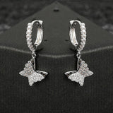ICED BUTTERFLY DANGLE EARRINGS [18K WHITE GOLD)