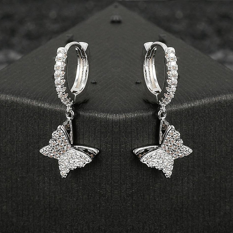 ICED BUTTERFLY DANGLE EARRINGS [18K WHITE GOLD)
