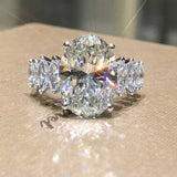 WOMENS MALVOS BRILLIANT OVAL CUT WITH MARQUISE SHAPE SIDE STONES RING - Malvos